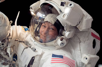  In this image from Jan. 30, 2008, Expedition 16 commander Peggy Whitson, the first female commander of the International Space Station, participates in a seven hour, ten minute spacewalk. During the spacewalk, Whitson and astronaut Daniel Tani, flight engineer, replaced a motor at the base of one of the station's solar wings.