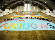 LONDON, UK -- More than 40,000 brightly coloured postcards were laid down by volunteers from Santander, Opus Energy and Manheim Auctions in the shape of a rainbow to create a spectacular mosaic design; the finished project measured a massive 30.05 metres by 21.2 metres, making a total area of over 630m² and setting the new world record for the Largest postcard mosaic, according to the World Record Academy.