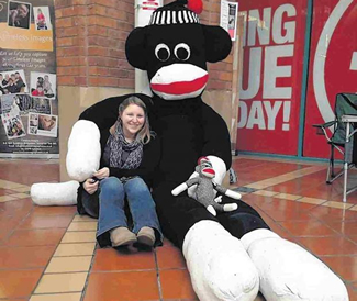  Jody Lewis with her giant sock monkey which has secured a World Record. Jody Lewis, 27, spent a week constructing the 10ft 6ins tall toy cutting up 66 pairs of socks and stitching them back together into a monkey shape. She then stuffed it with 15kg of polyfibre to bring it to life.