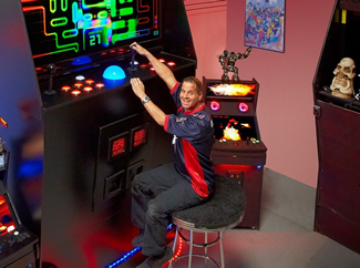 Chigaco-based network engineer Jason Camberis has built the world's largest arcade machine. To keep things to scale, giant quarters are required to fire up the machine.