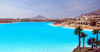 Crystal Lagoons broke the record for the "World's Largest Crystalline Lagoon" with the completion of its latest project in Egypt. The record-breaking lagoon is 30 acres of crystal-clear water surrounded by white sandy beaches - perfect for swimming, sailing, kayaking and more.