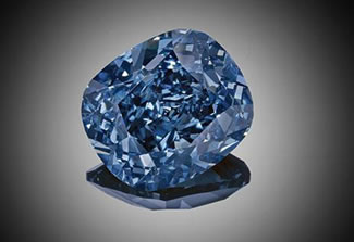  The extremely rare and flawless "Blue Moon Diamond" sold for $48.4 million to a Hong Kong buyer, setting a world record for a gemstone at auction. The cushion-shaped diamond, mounted on a ring, has the top grading of fancy vivid blue and weighs 12.03 carats. 