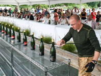 most champagne bottles sabered in one minute world record set by Mitch Ancona