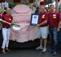 Photo: Guinness World Records judge Philip Robertson and Rachel Kyllo, SVP of Sales and Marketing, Dan Williamson, Director of Sales and Distribution and Randy Fricke, Marketing Manager of Kemps Dairy celebrate as Kemps Sets Guinness World Record for World's Largest Ice Cream Scoop.