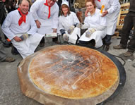 Photo: On St David's Day this year, the people of Bala turned out in their hundreds to watch a team from Bala and Penllyn Tourism Association and Ysgol y Berwyn attempt to create the biggest Welsh cake in the world. Pictured from left to right ? Gwyn Evans, Official to check that all the rules are kept; Peter Cottee; Huw Price, Official; Tyly Roberts; Mari Davies and Lindsay Hind.