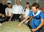  The World's Largest Raviolo required 4 kilograms of flour, 40 eggs, and two cups of olive oil to make, while 2.3 kilograms of ricotta cheese and 4.5 kilograms of spinach were used for the filling. The round pasta dish took 40 minutes to cook and was prepared in celebration of Volgograd's City Day.