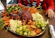 The 35 feast is made up of a whole turkey, 25 roast potatoes, 25 parsnips, 25 stuffing balls, 25 pigs in blankets, 25 carrots, 25 sprouts, 25 pieces of broccoli and cauliflower, a pint of gravy and lashings of cranberry sauce. The 6,000-calorie meal at the Duck Inn, Redditch, Worcs, will feature in the 2015 Book Of World Records.