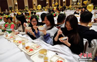 A total of 388 people gathered at the Shangri-La Pudong Hotel to break a previous Guinness World records world record of 288 breakfast eaters set in Australia in 2012; the event was held inside the Grand Ballroom at the Shangri-La Pudong Hotel and sets the new world record for the Largest breakfast in bed (Most people eating breakfast in bed), and was orchestrated by the More Than Aware organization, which aims to bring more money and research to the cause of defeating breast cancer, according to the World Record Academy: www.worldrecordacademy.com/.