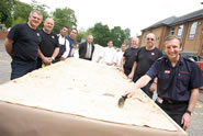  Chief Dave Curry helping cut up the bread, which measured a whopping 3.79m by 1.4m and weighed a hefty 26kg. The Hampshire firefighters' enormous naan bread, which was sold for £3 per portion with a curry, raised money for The Fire Fighters Charity, Water Wells Project and Hampshire Hurricanes.