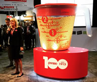 World Kitchen Celebrates Pyrex® Brand's 100th By Unveiling World's Largest Measuring Cup At International Home + Housewares Show. The cup is approximately 3,000 cups large and more than 1,500 times the size of the iconic 2-cup measuring cup, owned by cooking enthusiasts worldwide. To stay true to the Pyrex brand heritage, the cup was made in the U.S.A. The cup features the familiar red markings and is made out of acrylic.