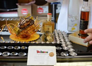  For $100 apiece, the sweet treat is made up of 24 carat gold, diamonds, chocolate aged balsamic vinegar, ice wine. The remaining ingredients are top secret. The decadent donut was crafted for the grand reopening of a longtime bakery in Kelowna in its new location.