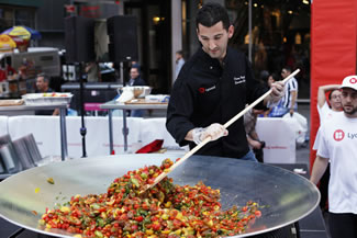  LycoRed celebrated its 20-year anniversary during National Tomato Month with a Guinness World Record for the largest display of tomato varieties in Times Square New York. LycoRed displayed more than 130 varieties of tomatoes. In addition to its display of tomato varieties, a giant tomato salad was constructed by the LycoRed team and Chef Donny Rogoff in a giant wok on a stage in the middle of Times Square. It was made with heirloom cherry tomatoes with a red wine citrus vinaigrette. 