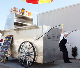  The world's largest hot dog cart measured at 9 feet, 3 inches tall by 23 feet, 2 inches long and 12 feet, 2.75 inches wide. 