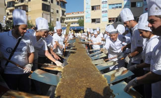 The World's Longest Pastry is a 105 foot long manoucheh, the crisp, light and fulfilling za'atar-topped focaccia that anchors the traditional Lebanese breakfast.