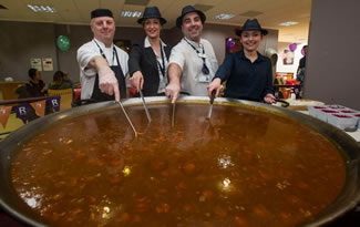  Chefs Peter Dilsworth, Sarah Turner, Dan Jordan and Leanne Williams add the finishing touches to the world's biggest pan of Scouse to help raise money for the Royal Liverpool University Hospital's main charity, R Charity.