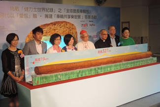 Cardinal Zen of Hong Kong blesses the World's Longest Raisin Loaf which was used by Catholic charities for raising money to help the elderly. 