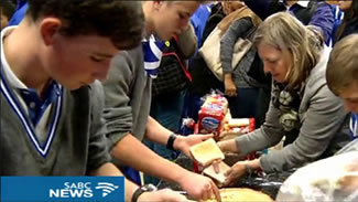 St Andrews pupils made 29 000 sandwiches in just 60 minutes. The effort involved over 3000 loaves of bread, 1500 kilograms of peanut butter, 100 kilograms of jam.