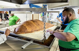  Smashing all records, a king-sized samosa weighing 153.1kg has earned the tag of being the world's largest. The gigantic snack was made by a dozen volunteers from the Muslim Aid UK charity and then deep-fried in a custom-built vat at East London Mosque. 