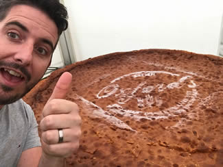 Steven Oxford, from Alweston, near Sherborne, Dorset, has created a giant Victoria sponge cake just under 5ft (1.5m) wide and 8.5 inches (21cm) in height, which sets the new world record for the Largest Sponge Cake.