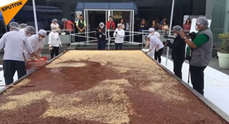 The mammoth chocolate bar was made using more than two tons of pure cocoa, nearly 400 gallons of milk, 1500 pounds of sugar, 44 pounds of chestnuts and walnuts, and 66 gallons of water. Chocolatiers from all over Peru raised 250,000 Peruvian soles, or nearly $97,000, for the project and worked 8 hours straight to make the bar. 