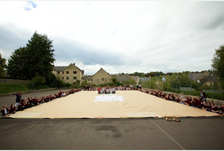 The record-breaking bag is 73ft-long, 50ft-wide and 11ft-deep and took around 300 primary school children an entire day to complete.