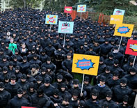 Employees of the Nexen Energy company gather in a park in Calgary Alberta to set a new world record for the Largest Gathering of People Dressed as Batman. The event kicked off Nexen's 2014 United Way campaign.