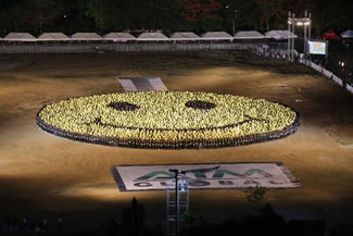 A total of 6,667 people gathered by a business firm form "the biggest" human smiley on Saturday, May 30, during an event at the Quirino Grandstand in Manila, in an attempt to get the world record award.