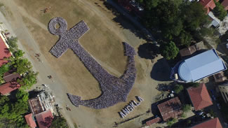 Students of the University of Antique-Sibalom Campus formed an image of an anchor as they vied for a World Record for the world's largest human anchor formation. Around 6,000 thousand students and teachers formed the anchor, which is a symbol of seafarers.