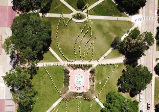 A camera-equipped drone flying 400 feet overhead captured the "FSU Torch of Innovation" that students formed. Nearly 300 students at Florida State University successfully formed the world's largest human "FSU Torch" on campus. It stretched across Landis Green from near Strozier Library to Landis Hall.