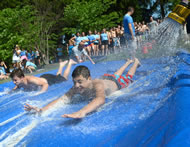 The eighth graders to 12th graders students slid down the 74.5-foot slide over and over to beat the previous record of just under 20 miles. They had to slide down almost 1,400 times.