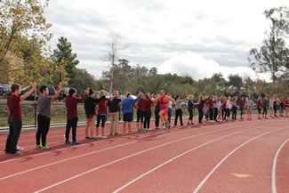  385 high fives were given to FitzSimons, a tally that will set a new World Record mark for the most high fives in 60 seconds. Photo: Santa Barbara Track Club.