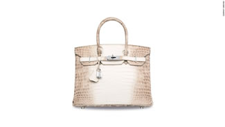 This Hermes signature Birkin is made with white matte Himalayan crocodile leather, and features hardware made from 18k white gold and diamonds. It sold for $300,168, making it the most expensive handbag ever sold.