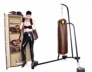 Lagerfeld's boxing designs are part of Louis Vuitton's "Celebrating Monogram" project, in which high-profile designers create high-price items, such as Christian Loubotin's $23,000 shopping trolley and Frank Gehry's $4,400 "Twisted Box." The centerpiece of his lineup is a serious, full-size punching bag (above) complete with a storage trunk, a stand, a mat, and boxing gloves that retails for approximately $175,000. Produced in a limited quantity, the luxe set is touted as an exceptional collector's piece and is covered in Vuitton's signature logo.