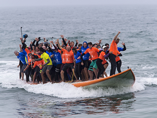  A total of 66 surfers have broken the world record for the most people riding on a surfboard at once. A crowd of 5,000 spectators watched the group as they rode the board for 12 seconds. 