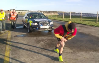 Paramedic Ross Filby in his attempt to pull a 2.1 tonne vehicle for more than 3.5km for NARS charity at the former RAF Coltishall airbase in Norfolk.
