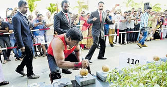 Abeesh P. Dominic, a native of Poonjar in Kottayam district, broke 124 coconuts with bare hands in a minute.