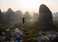 Alexander Schulz from Germany managed to break the Guinness World Records' record for the longest distance walked on a highline in Guilin, Guangxi, where he spent days crossing a 375-meter-long rope while balancing 100 meters above ground - setting the new world record for the Longest distance walked on a highline, according to the World Record Academy: www.worldrecordacademy.com/.