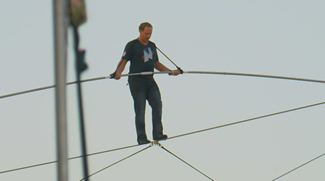 Nick Wallenda took 33 minutes to cross a 1,576-foot (480 metres) wire that was strung more than 10 storeys high above a racetrack in Wisconsin.