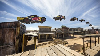  Bryce Menzies has made history by jumping his off-road truck 115 metres over a New Mexico ghost town to set a new truck distance record.
