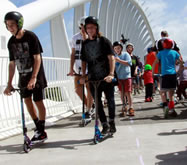 NEW PLYMOUTH, New Zealand -- More than 500 people, of all ages, took part in Taranaki Scooter-licious which aimed to break the Guinness World Records' record for the largest kick scooter parade; scooter riders set off from Te Rewa Rewa Bridge, and rode along the Coastal Walkway to the East End Reserve; 489 participants officially finished the course, setting the new world record for the Largest Kick Scooter Parade, according to the World Record Academy: www.worldrecordacademy.com/.