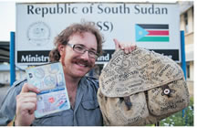 first person to visit all nation swithout flying world record set by Graham Hughes