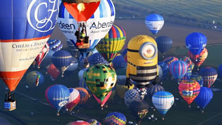  The cohort of 85 hot air balloons flew from Dover to Calais early on Friday morning, in an attempt to beat the current world record for the largest group of air balloons to cross the Channel, which stands at 49.