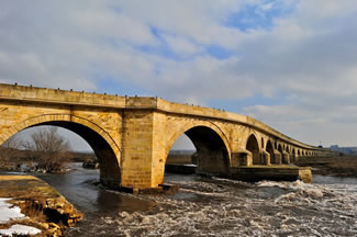 The Uzunköprü Bridge, located in Turkey's Edirne province, connects Turkey to the Balkans and Europe; it is a 15th-century Ottoman bridge, which gave its name to the town of Uzunköprü and has 174 arches, is 1,392 m (4,567 ft) long and up to 6.80 m (22.3 ft) wide, thus setting the new world record for the Longest stone road bridge, according to the World Record Academy.