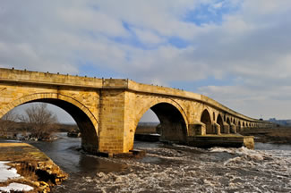 The Uzunkpr Bridge, located in Turkey's Edirne province, connects Turkey to the Balkans and Europe; it is a 15th-century Ottoman bridge, which gave its name to the town of Uzunkpr and has 174 arches, is 1,392 m (4,567 ft) long and up to 6.80 m (22.3 ft) wide, thus setting the new world record for the Longest stone road bridge, according to the World Record Academy.