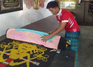 Mr. Ab Majid Ab Rahman from PMC Pahang, Cherating, Pahang, has made an 17.8-m long (and 1 m width) beaded art, tied each other by strings with variety of colours and motives, which sets the new world record for the Longest beaded Art, according to the World Record Academy.