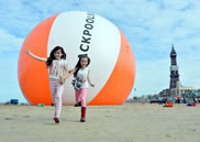  Measuring a staggering 18m in diameter, the orange and white beach ball was custom-made, weighing in at 400kg - about the same as an adult horse.