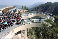 The world's longest glass skywalk has opened to tourists at the Longgang National Geological Park in the southwest Chinese city of Chongqing. The glass observation bridge measures 26.68 metres in length--five metres longer than the skywalk at the Grand Canyon in the U.S. state of Arizona.