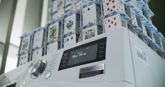 Bryan Berg, a world-record holder in card stacking, constructed a 48-story house with 10,800 cards on LG's Centum washing machine, setting a new world record.