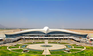  The terminal building's design was inspired by famous national bird, Lacyn which is a falcon species found mainly in Turkmenistan. The new terminal building, of which the design was inspired by the national symbols of Turkmenistan, will be able to host 14 million domestic and international passengers annually to IATA Class A service standards with a total enclosed area of 161,851 m.