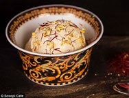 The "Black Diamond" treat at Scoopi Café is a mix of high-price ingredients with 23-carat edible gold sprinkled on top. It is made of Madagascar vanilla ice cream, along with the an expensive Iranian saffron and is decorated with slices of black Italian truffle. The decadent dessert is served in a Versace bowl and with a Versace spoon, both of which can be kept by the customer. 